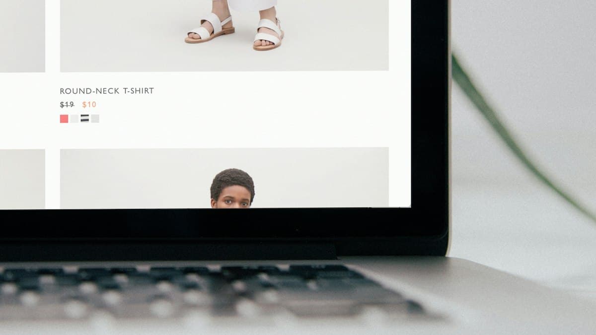 A laptop showing an online clothing store